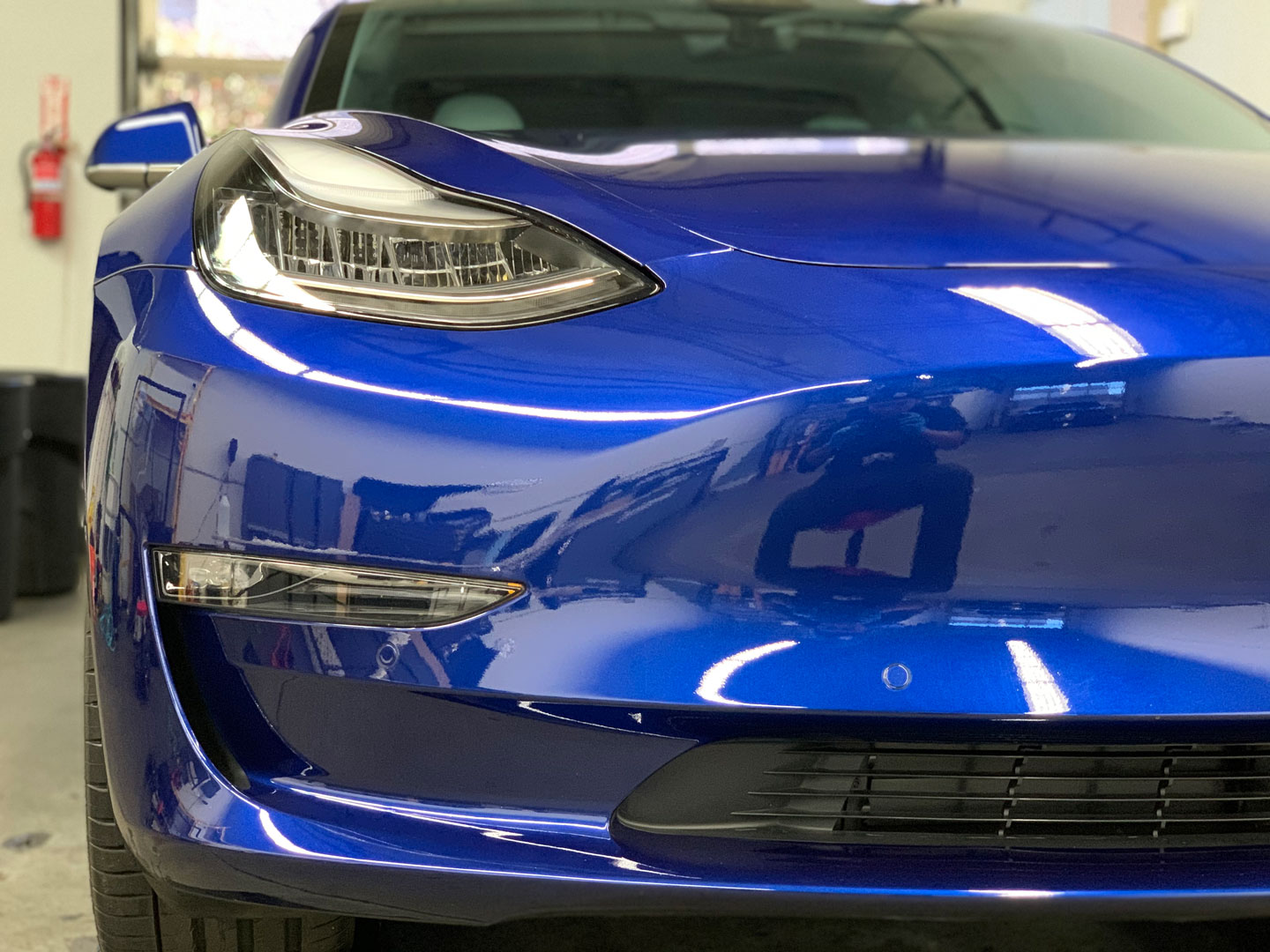 shiny blue car front bumper