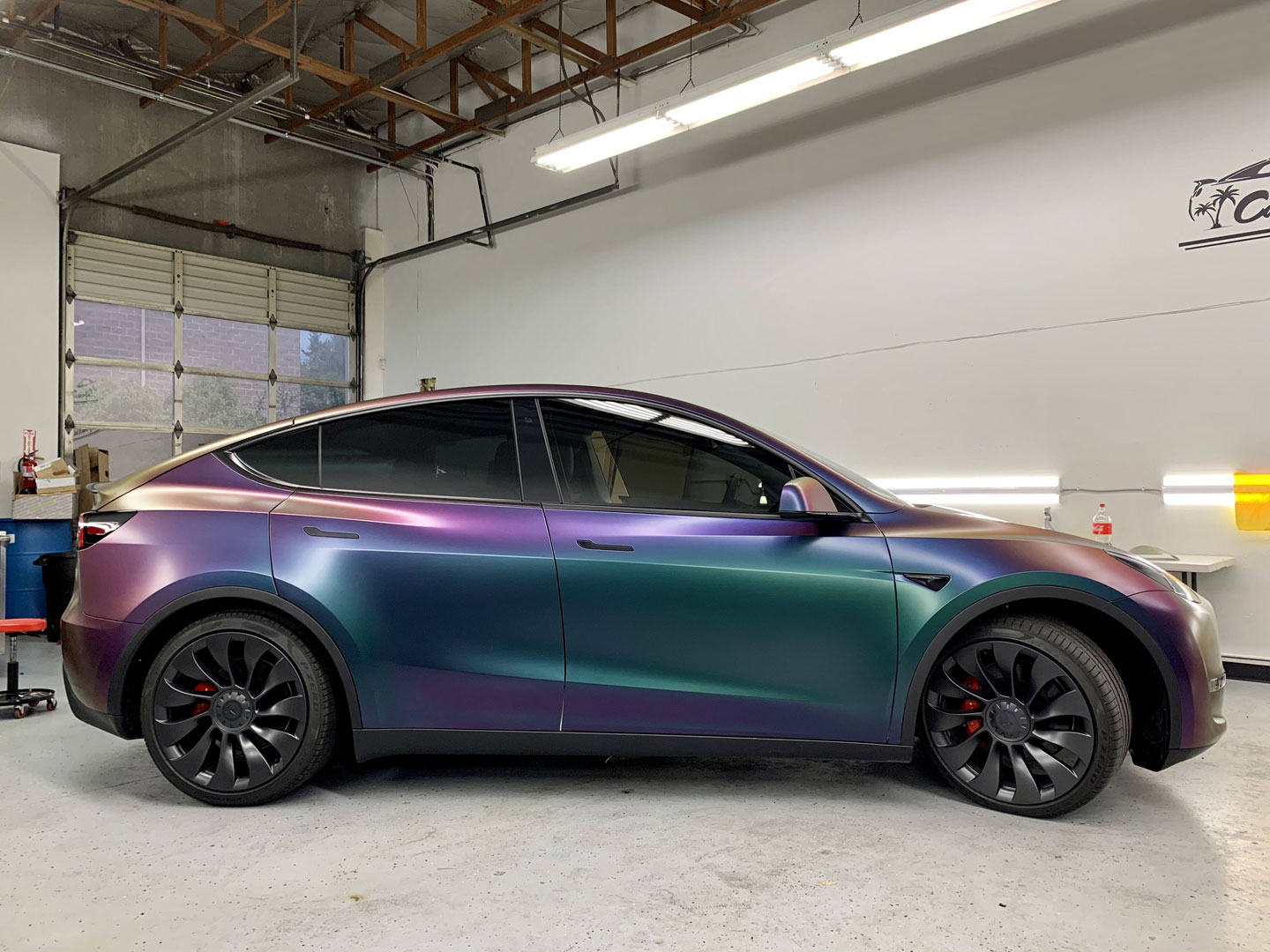 purple iridescent film on black car body