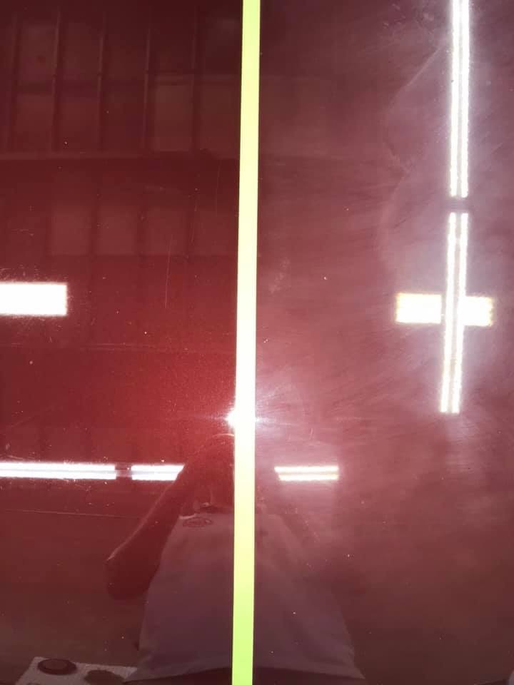 comparison of red car side panel with and without paint correction